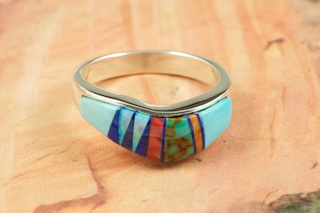 Genuine Sleeping Beauty Turquoise, Spiny Oyster Shell and Blue Lapis inlaid in Sterling Silver. Beautiful Fire and Ice Lab Opal Accents. Stunning Ring Designed by Navajo Artist Calvin Begay. Signed.